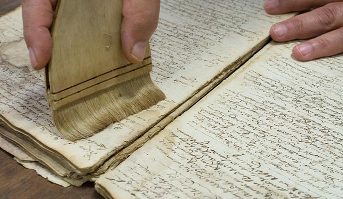 Professional worker restoring documents
