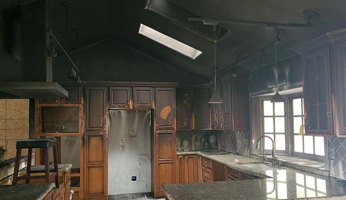 Professional personal restoring a fire damaged house