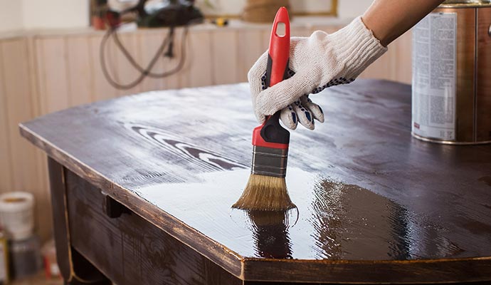 Profesional worker restoring furniture