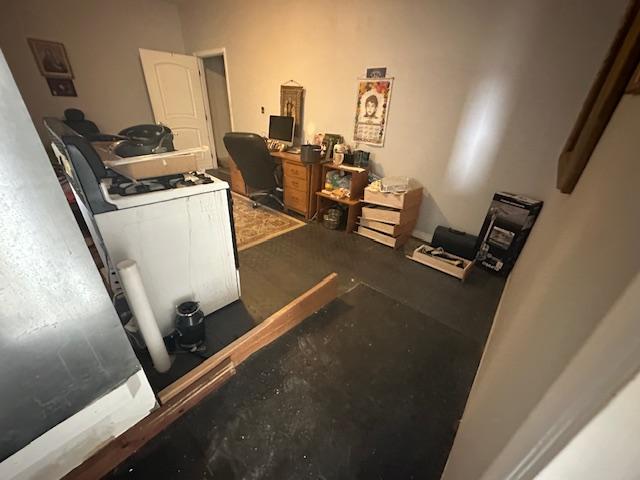 Kitchen area with sub-flooring exposed during water damage restoration from an upstairs plumbing leak. Expert flooring restoration and ceiling repair services by dkirestotech.