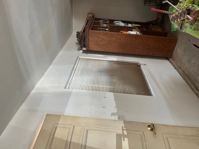 In-progress fire damage cleaning showing professional soot and smoke residue removal from walls and surfaces, essential for complete property cleanup and restoration.