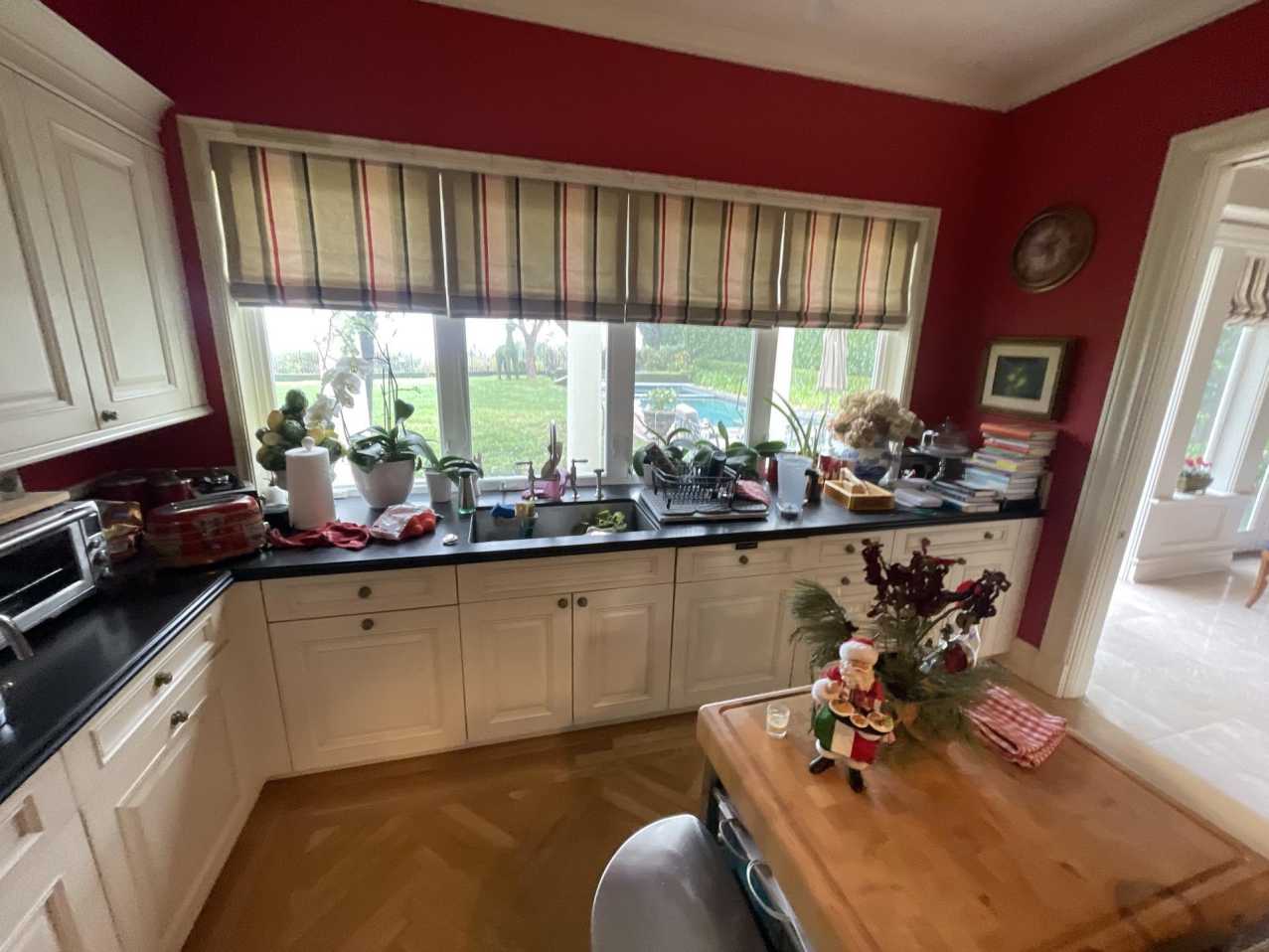 A residential kitchen requiring thorough smoke and soot removal following wildfire damage. Our property restoration services include meticulous cleaning of all surfaces, cabinets, and appliances to eliminate microscopic residue and complete the odor removal process.