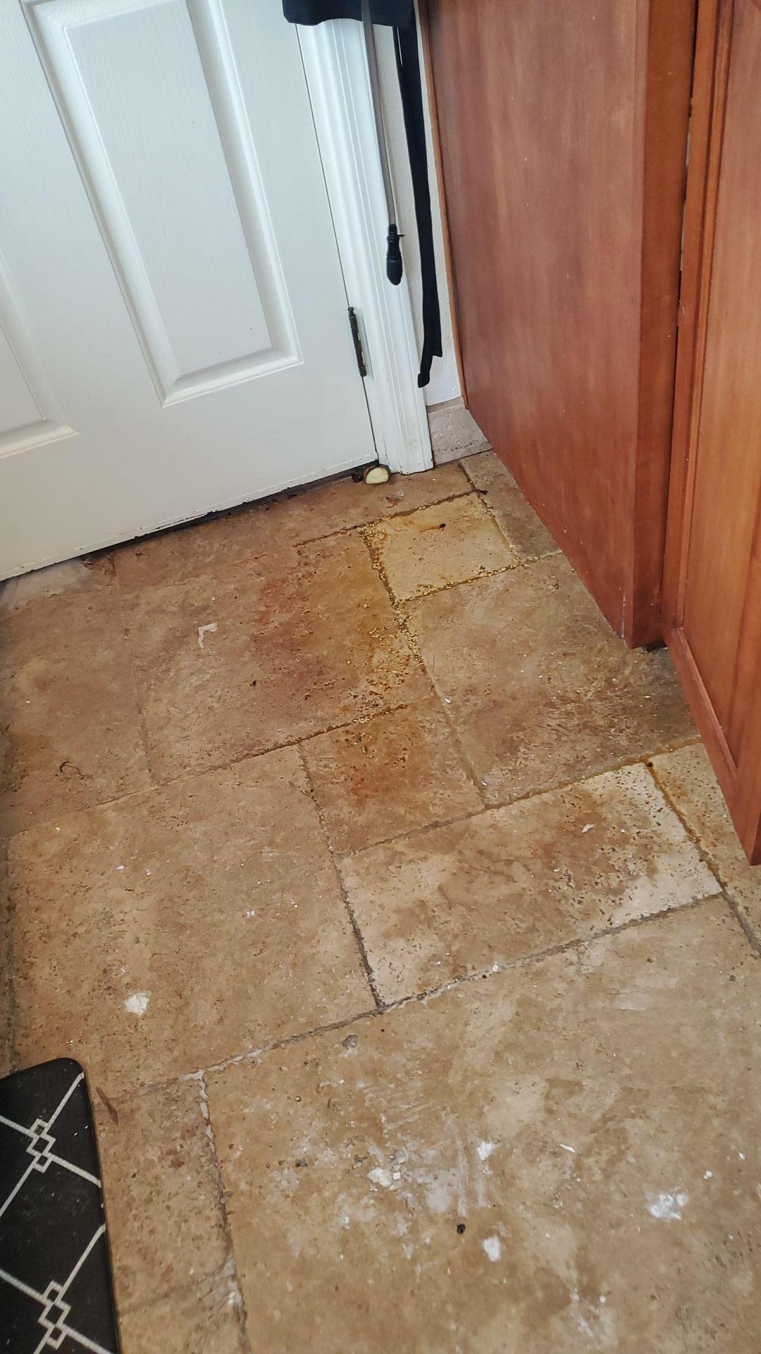 Kitchen tile damage from combined fire and water, showing residue requiring expert soot and smoke removal and water damage cleanup for complete property restoration.