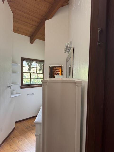 Completed smoke damage restoration in a hallway, showing cleaned walls, mirrors, and vaulted ceiling, with successful soot cleanup and odor removal to restore air quality and the property's look.