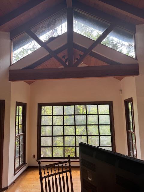 Smoke damage restoration on a vaulted ceiling and exposed wooden beams, demonstrating professional soot cleanup and odor removal services to restore complex architectural areas and improve air quality.