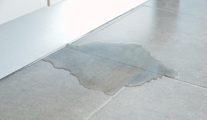 Leaking water on tile floor