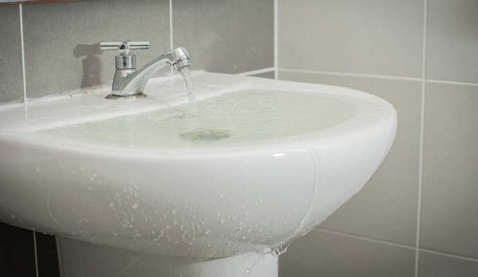 Water overflowing from bathroom sink