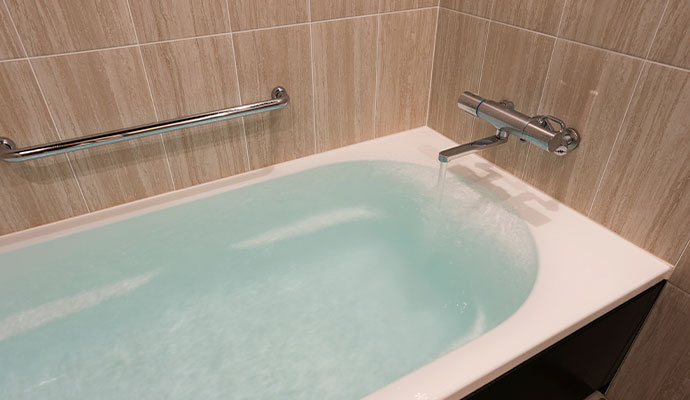 Water overflowing from bathtub